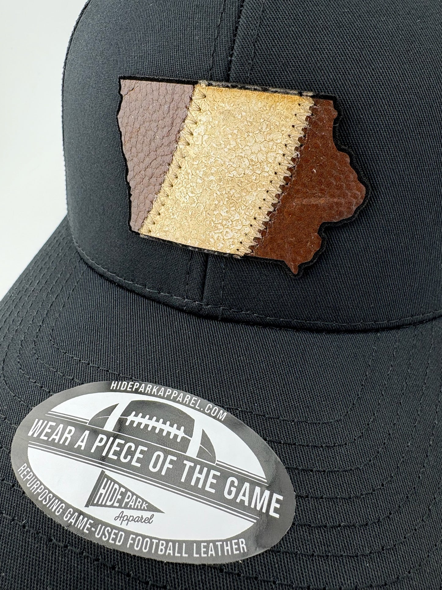 The Iowa Stripe Trucker Hat | Game-used Football Leather